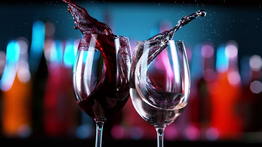Super Slow Motion of Red and White Wine Glasses in Cheers Gesture, Bar on Background. Speed Ramp Effect. Filmed on High Speed Cinema Camera, 1000 fps.