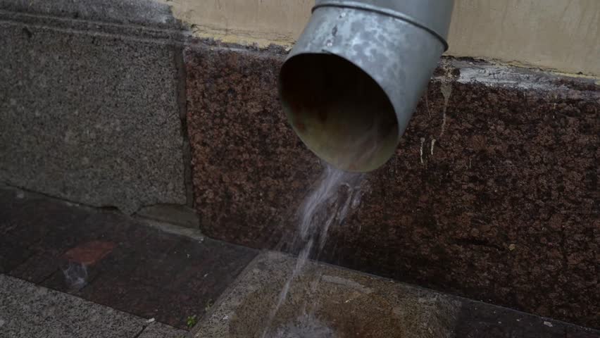 rainwater drains from the downpipe during heavy rain Royalty-Free Stock Footage #1111087145