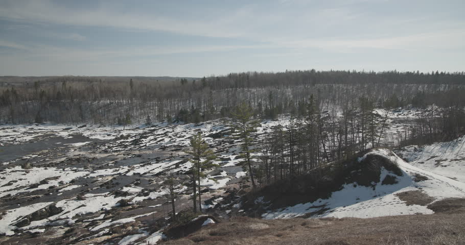 Pan of Saint Louis River Minnesota at Jay Cooke State Park in Winter Thaw