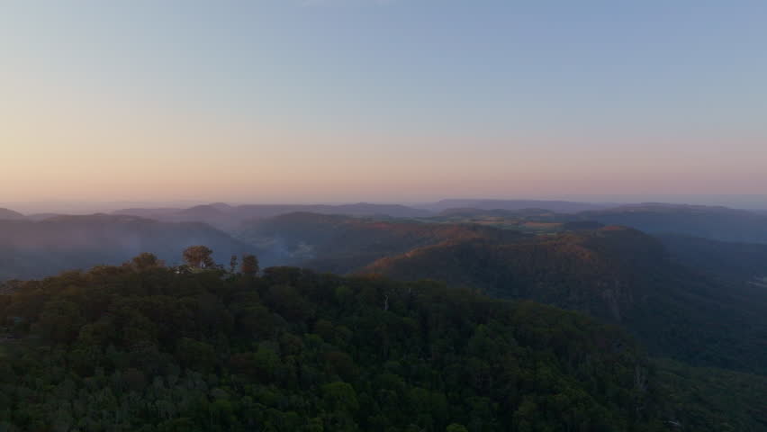Beautiful Sunset Sky Over Lamington National Park Mountains In Shadow, 4K Drone Slow Motion