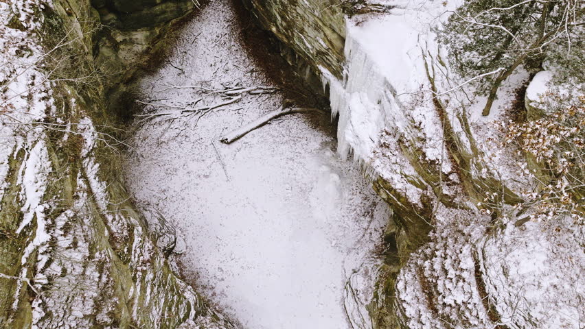 Drone video of the starved rock state park area in winter with snow falling