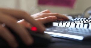 fingers of a man playing on a computer keyboard