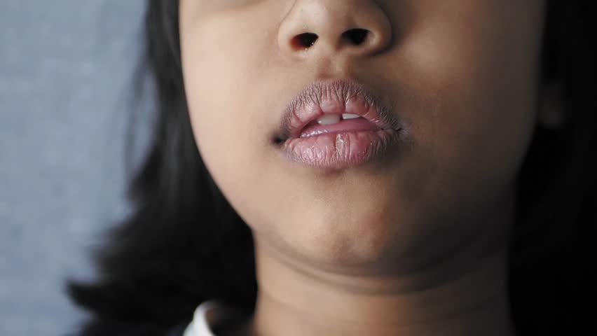 close up of child screaming at home 