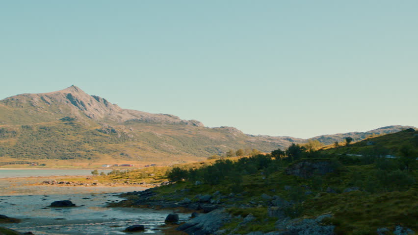 A majestic towering view of mountains through a panoramic shot moving from right to left