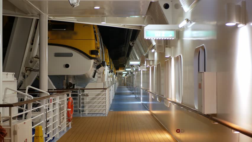 view on passenger cruise ship life boat deck while cruising traveling in international open sea in night time, muster area on cruise ship, night time cruise ship vacation Royalty-Free Stock Footage #1111113399