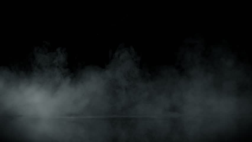 Super Slow Motion Shot of Atmospheric Smoke Slowly Floating on Black Background at 1000fps.