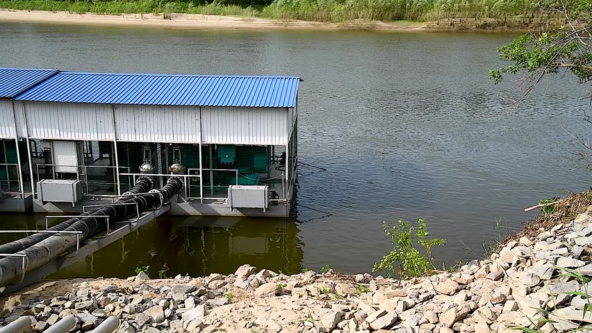 Water pumping station on the river. Pumping water into an irrigation system for irrigation of agricultural land