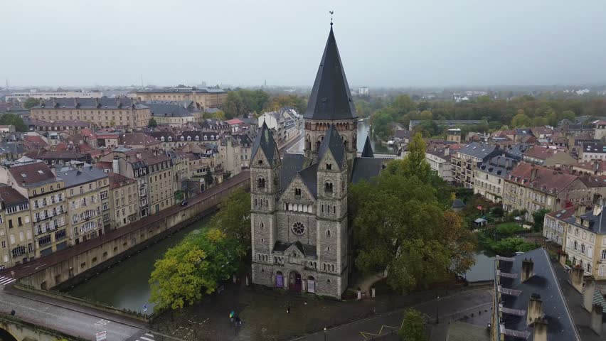 Aerial drone footage of Temple Neuf Metz France Protestant church on an island in the Moselle River