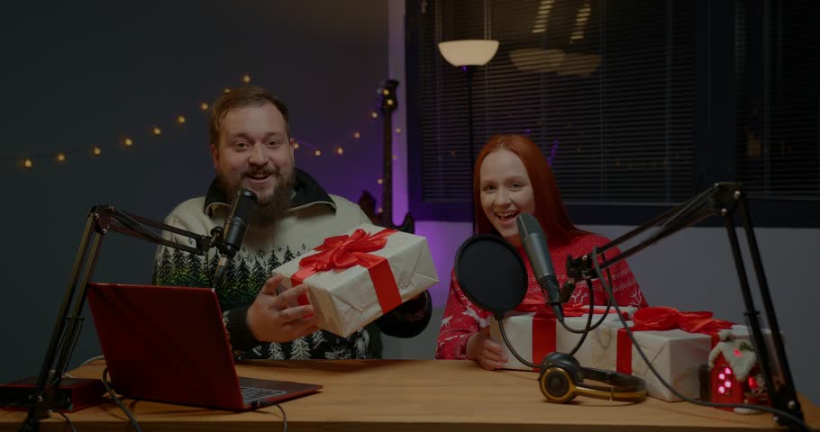 A couple of bloggers are doing a Christmas giveaway on their channel. Radio presenters in Christmas sweaters conduct a raffle of gifts among listeners.