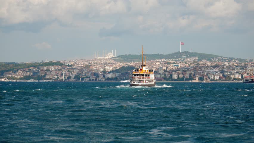 Cityscape in Istanbul, Turkey. DFlag and mosque towering over city, Istanbul, It is old landmark. Beautiful view of historical district of Istanbul. Boat trips on Bosphorus. .