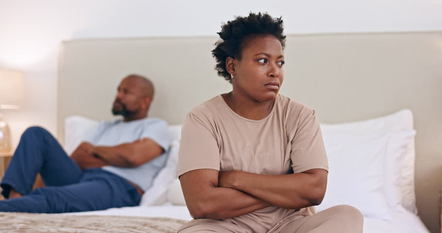 Frustrated black couple, conflict and divorce on bed in argument, disagreement or fight at home. African woman ignore man in bedroom dispute, cheating affair or breakup in toxic relationship at house Royalty-Free Stock Footage #1111140875