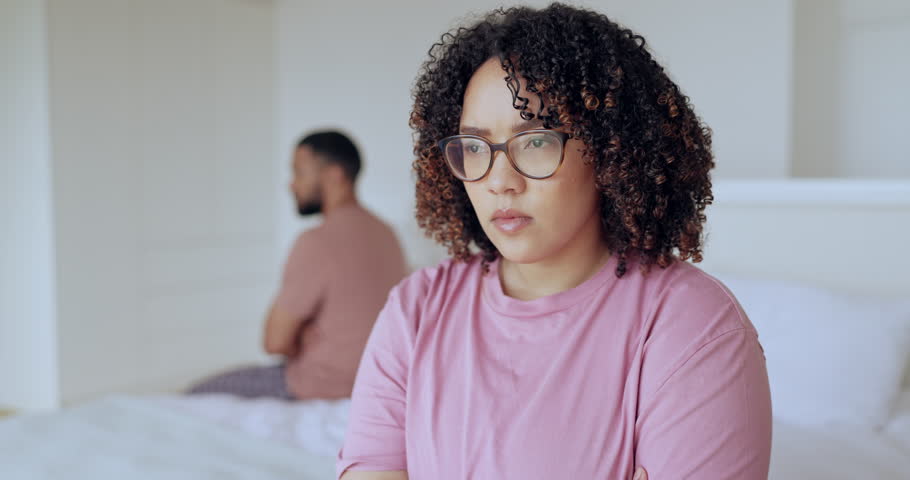 Woman, angry and conflict of couple in bedroom with stress, breakup and frustrated at home. Crisis, divorce and face of partner thinking of cheating, marriage affair or toxic fight of emotional drama | Shutterstock HD Video #1111141257