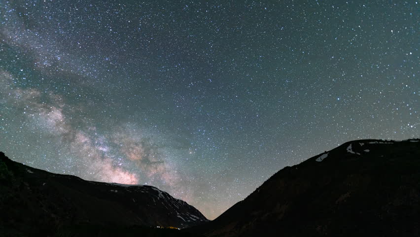 Timelapse of Milky Way galaxy over alpine peaks in Sierra Nevada mountains, California, USA