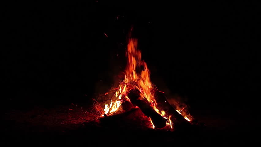 Night Bonfire Burns in the Dark Forest - Isolated on Black. Flaming Campfire at Nighttime. Place for Bonfire. Fire Pit Outdoors, Wood on Fire, Flying Sparks and Smoke - Slow Motion Royalty-Free Stock Footage #1111146363