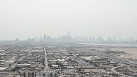 Aerial video of the suburbs of Dubai in the background of the new city