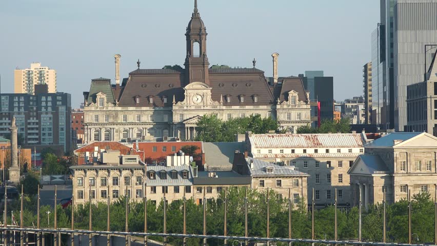 Montreal. Quebec, Canada. Panorama of the city. View from the St. Lawrence River. Montreal cityscape. Downtown, skyscrapers, buildings, old port. Beautiful blue sky, summertime.