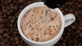 Hot instant coffee with foam close up. Pouring hot water in cup with instant coffee - Powered by Shutterstock - Get 15% off with code: PIKWIZARD15