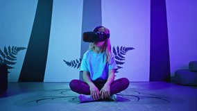 Female child using new technologies, having fun wearing virtual reality goggles in the VR room of natural history museum, front view. - Powered by Shutterstock - Get 15% off with code: PIKWIZARD15