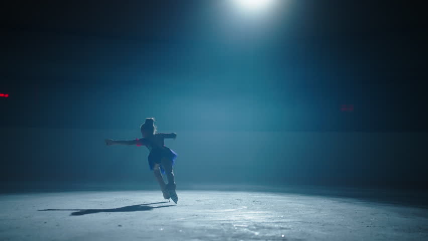Talented Child Training On Ice Rink, Cute Little Girl Spinning On Ice, Silhouette, Sport Children Royalty-Free Stock Footage #1111169387