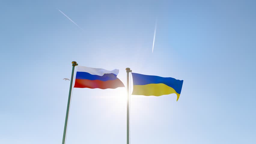Ukraine and Russia flags waving together on blue sky, looped video. 4K ULTRA HD.  Royalty-Free Stock Footage #1111173353