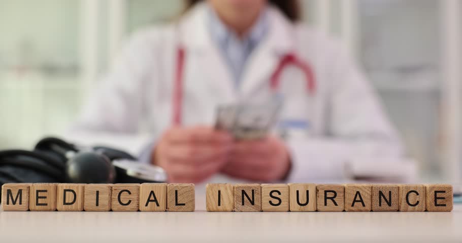 Doctor counts dollar bill and text health insurance. Earning profit from health insurance and corruption in medicine Royalty-Free Stock Footage #1111176741
