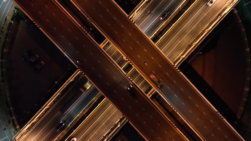 Time lapse expressway top view, drone aerial zoom out,  Circl Road traffic an important infrastructure in Bangkok Thailand, 4K, energy power Royalty-Free Stock Footage #1111181133