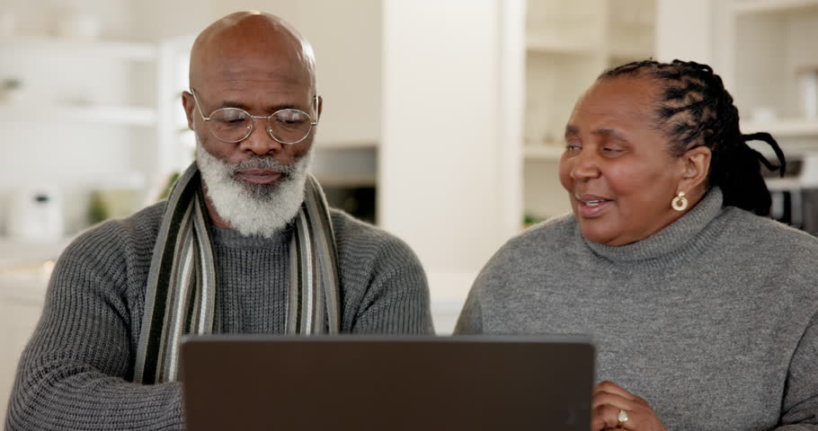 Senior couple, laptop and discussion in home for budget, finance review or check email notification. Elderly African man, black woman and computer for social network, planning and talk in retirement Royalty-Free Stock Footage #1111182295