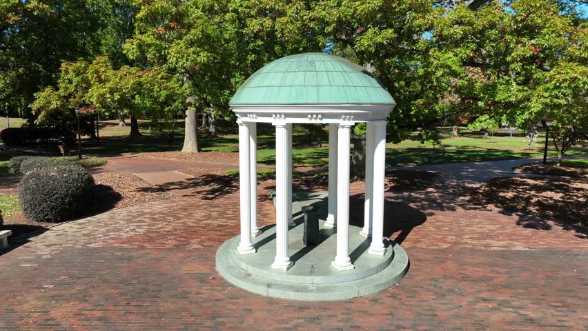 The Old Well at UNC Chapel Hill. Aerial orbit of a small, neoclassical rotunda located on the University of North Carolina at Chapel Hill campus.