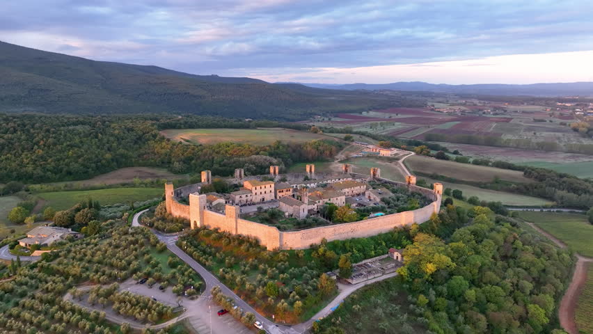 Aerial view of Tuscan landscape with ancient walled city Monteriggioni, Italy. Tuscany medieval town on the hill.