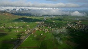 Aerial view of the town on the plain in spring time