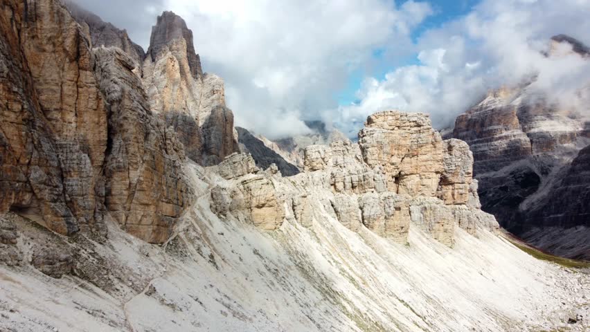 Drone flyover mountain ridge, revealing high mountain ladscape of Punta Fanes Sud, Dolomites