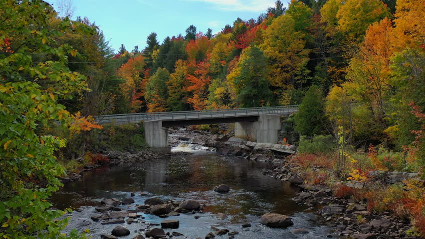 Aerial view of Fall (Autumn) foliage around the St. Regis River and Allen Falls in Potsdam, New York.