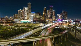 Aerial Hyperlapse Drone Fly Above Highway of Houston Texas USA at Night Lighting. Establishing Drone shot of City of Houston at night - Powered by Shutterstock - Get 15% off with code: PIKWIZARD15