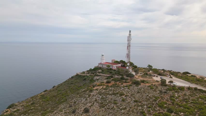 This is an aerial drone shot of the lighthouse in Javea, Spain. located on the costa blanca