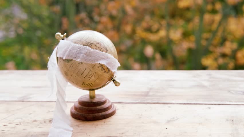 Female hands bandaging globe, environmental crisis and need to save planet, global healthcare and combating global pandemics, global threats, consequences of environmental issues for planet Royalty-Free Stock Footage #1111212079