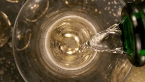 Super slow motion of pouring champagne into glass with camera motion. Filmed on high speed cinema camera, 1000 fps. - Powered by Shutterstock - Get 15% off with code: PIKWIZARD15