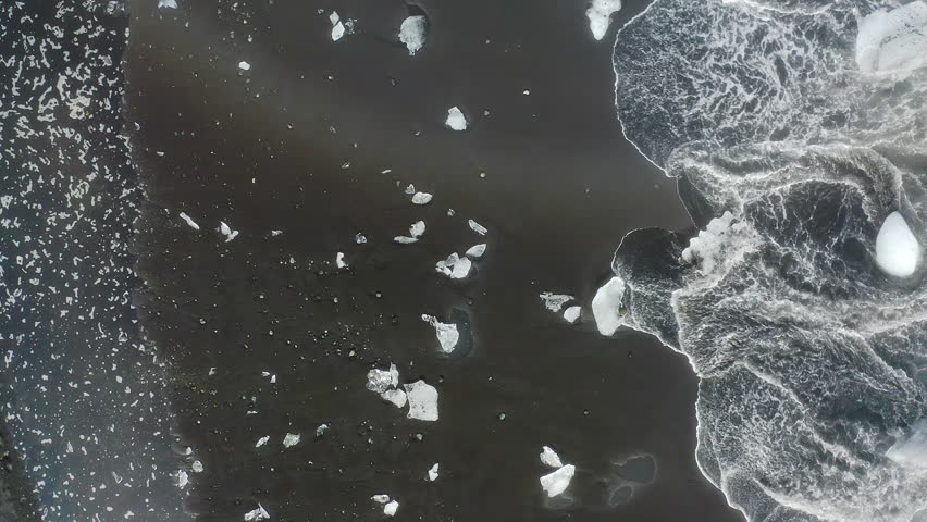Aerial view of Diamond Beach, Iceland, where the icebergs that flow into the sea, after leaving the Jokulsarlon glacier, end up melting on the shore.