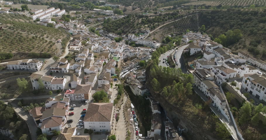 Setenil de las Bodegas is a town in southern Spain. It’s known for its whitewashed houses built into the surrounding cliffs. Royalty-Free Stock Footage #1111231759