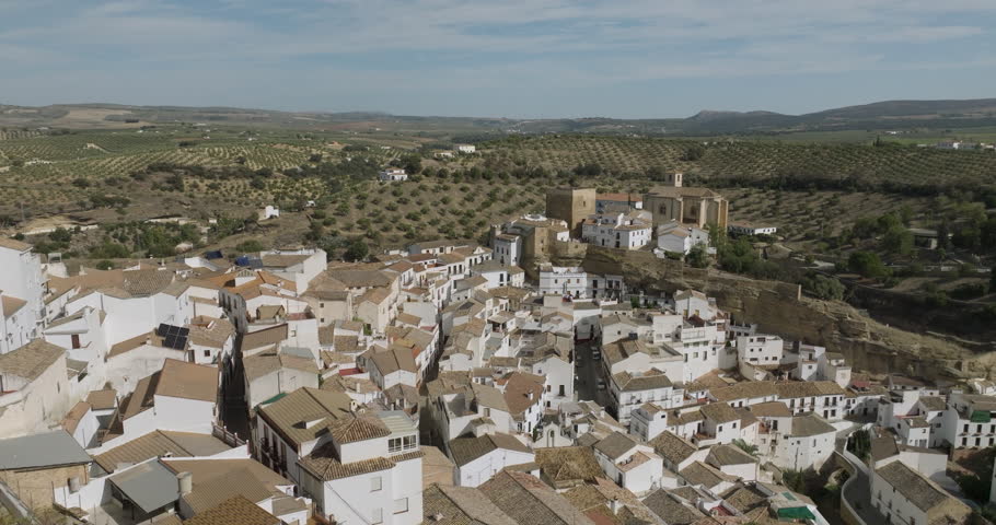 Setenil de las Bodegas is a town in southern Spain. It’s known for its whitewashed houses built into the surrounding cliffs. Royalty-Free Stock Footage #1111231761