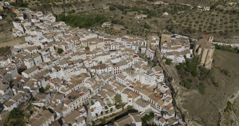 Setenil de las Bodegas is a town in southern Spain. It’s known for its whitewashed houses built into the surrounding cliffs. Royalty-Free Stock Footage #1111231767