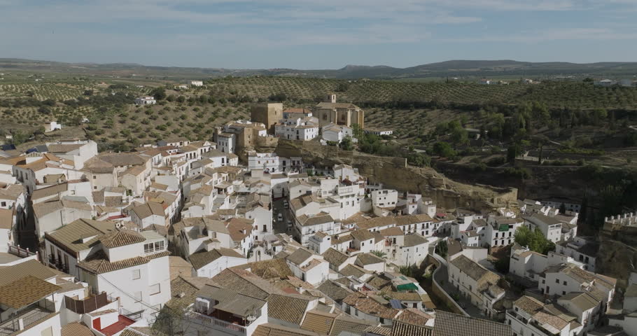 Setenil de las Bodegas is a town in southern Spain. It’s known for its whitewashed houses built into the surrounding cliffs. Royalty-Free Stock Footage #1111231771