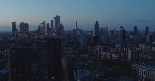 Aerial video of London City skyline at sunrise, dawn. Shot from a drone.