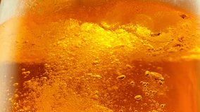 Super Slow Motion Detail Shot of Bubbling and Swirling Fresh Beer in Glass at 1000fps. - Powered by Shutterstock - Get 15% off with code: PIKWIZARD15
