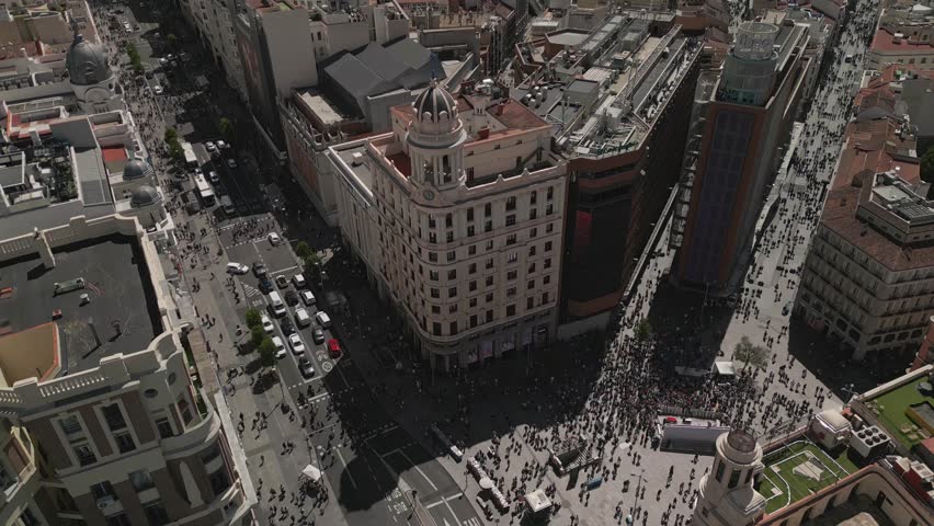 Establishing aerial view of Madrid Gran Via buildings architecture and cars driving on a beautiful sunny day, Madrid Spain tourism attractions Royalty-Free Stock Footage #1111244699