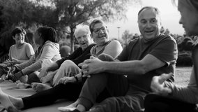 Multiracial senior people having fun together after yoga sport workout in nature city. Elderly international community. Black and white edit - Powered by Shutterstock - Get 15% off with code: PIKWIZARD15