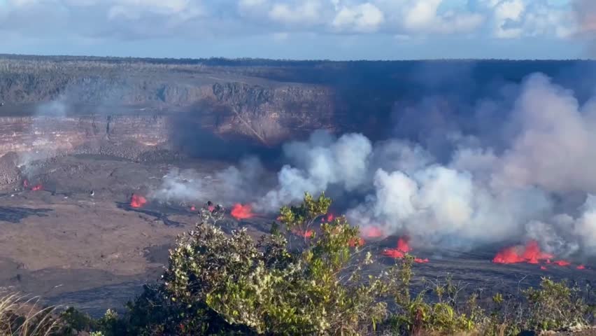 Cinematic wide panning shot of the lava fountains spewing from Kilauea a few hours after it began erupting in September 2023 at Hawai