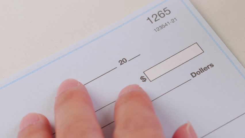 Close-up shot of a check being written.