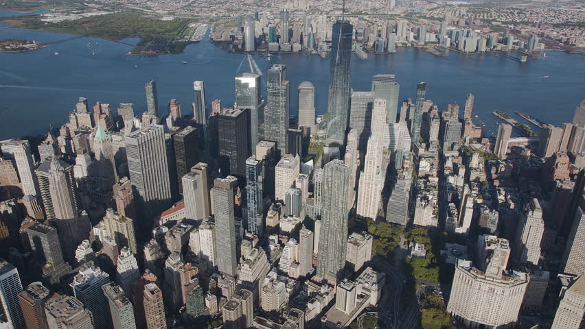 Aerial View of Manhattan Skyline and New York Bay. This Harbour is fed by the waters of the Hudson and East River. It contains several islands including Governors Island, Ellis and Liberty Island.  Royalty-Free Stock Footage #1111263573