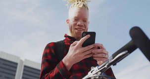 Animation of social media data processing over albino man on smartphone. Global computing, digital interface and data processing concept digitally generated video.