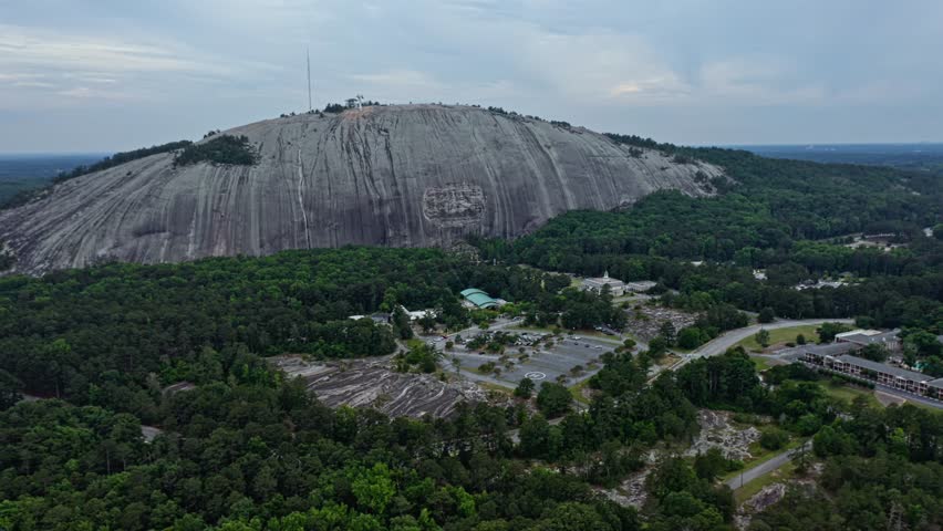 Aerial approaching shot of Granitic rock in Stone Mountain, Georgia, America
